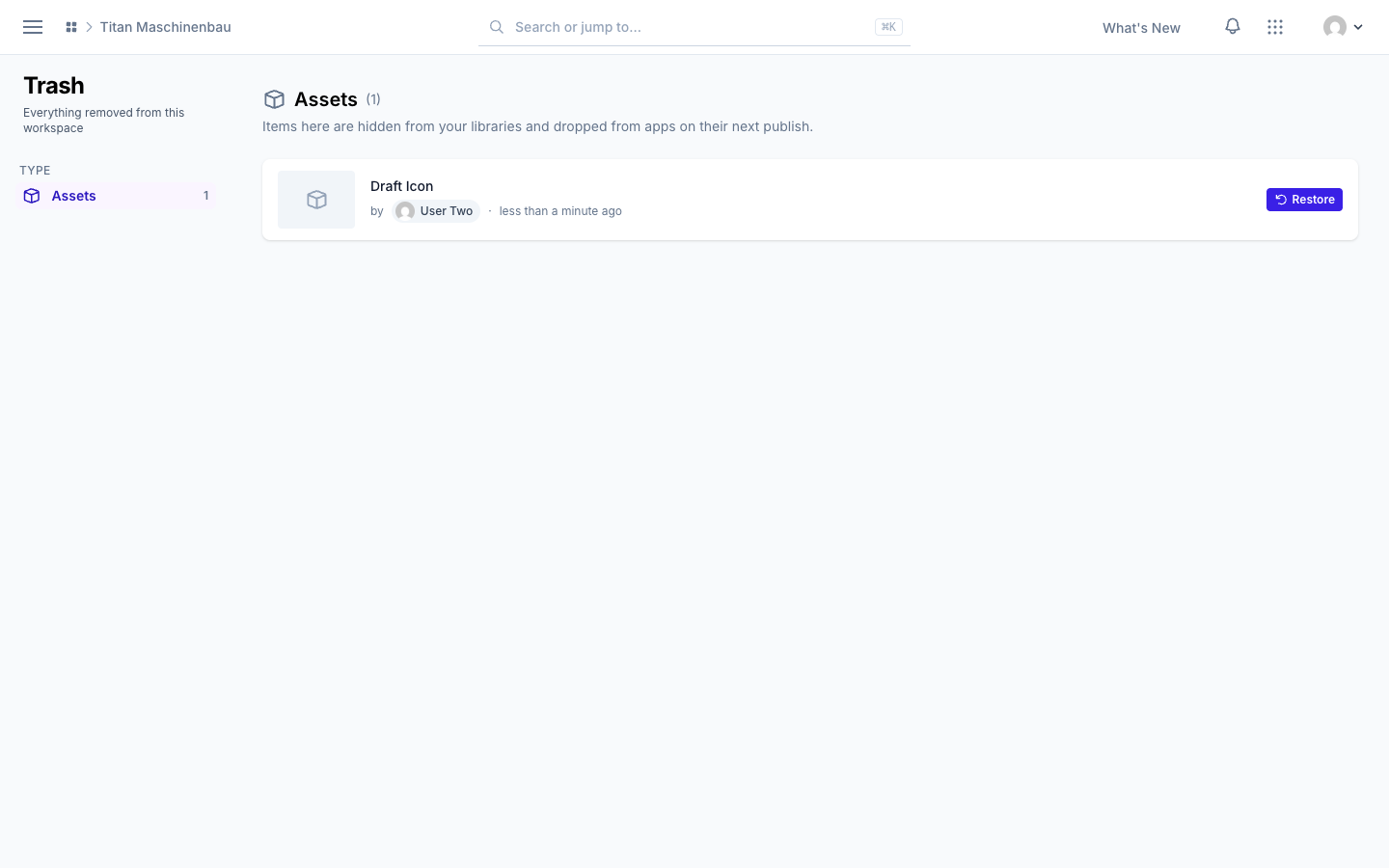 The workspace Trash with a trashed asset and its Restore button
